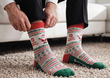 A happy customer receiving their corporate Christmas gift